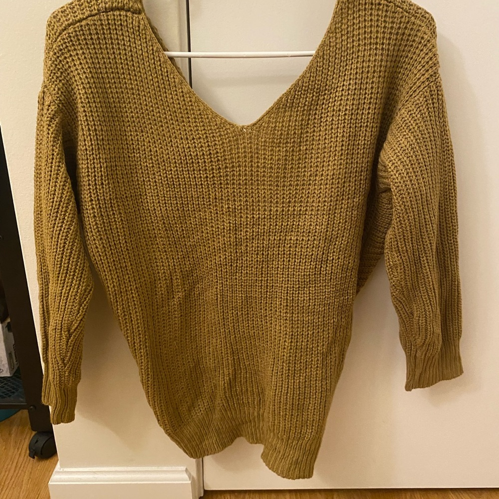 Light brown sweater with a knot back